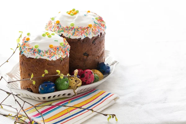 Russian easter cakes Kulich with dyed quail eggs