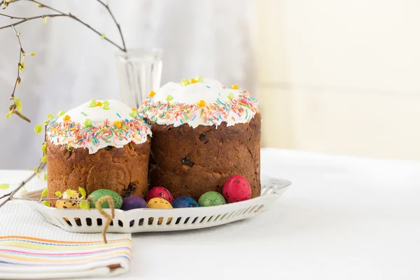 Russian easter cakes Kulich with dyed quail eggs