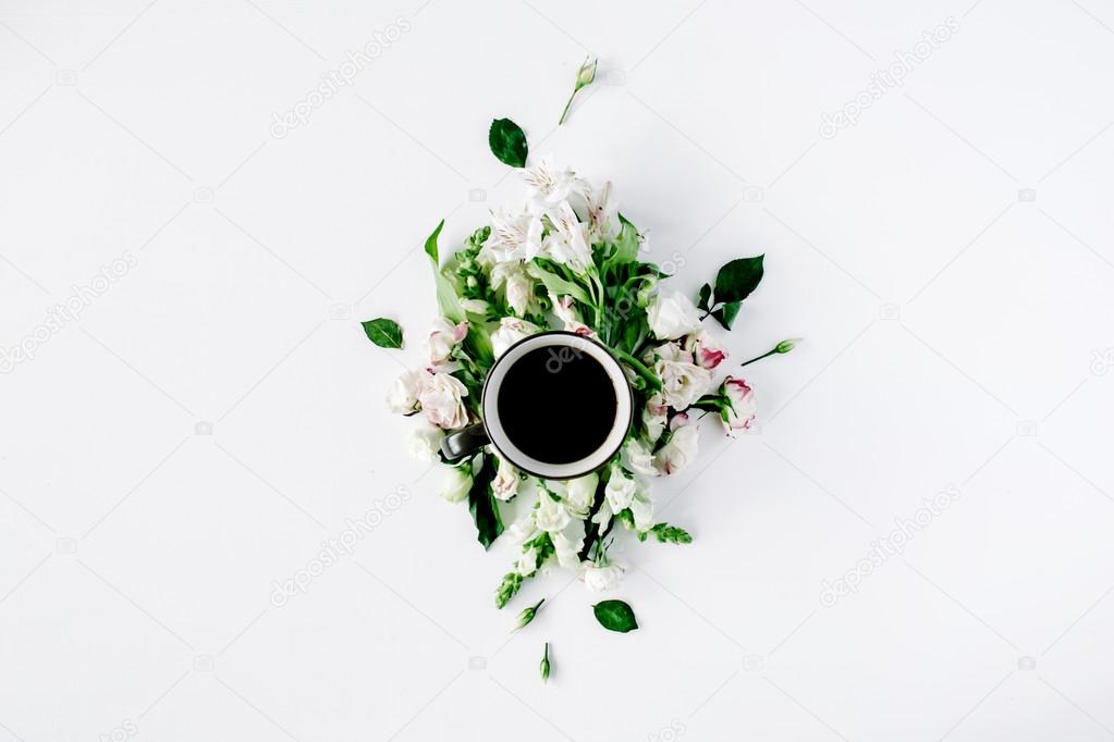 Coffee cup in flowers