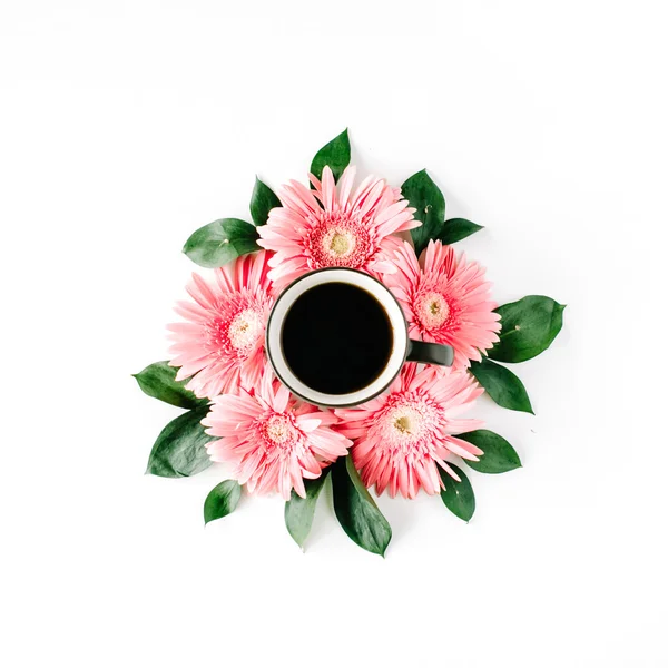 Coffee cup in gerbera flowers