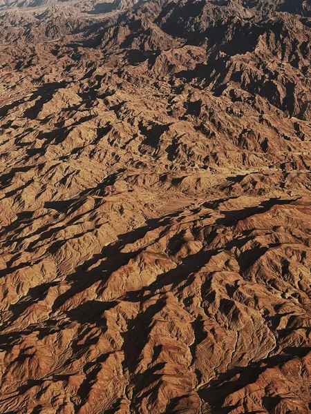 Aerial top view of desert with rock hills and mountains. Beautiful landscape background