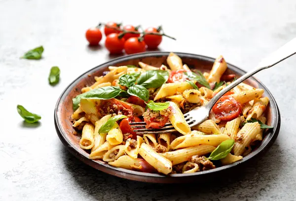 Pasta with meat and basil on a plate — Stock Photo © venge.mail.ua ...