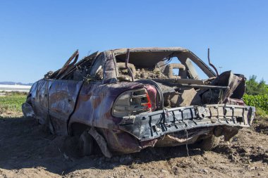 car that was destroyed in a pole after the hurricane, shattered car, which struck a natural disaster