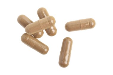 Beyaz arka planda izole edilmiş vitamin kapsülleri, üst görünüm. Sağlık takviyesi