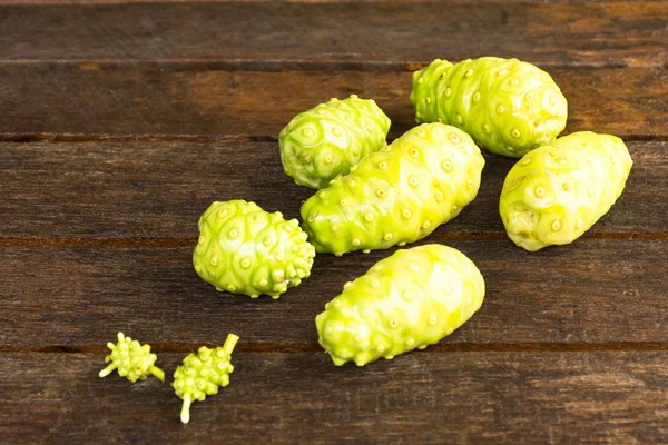 Noni fruit on wooden table.Fruit for health and herb for health — Stock Photo, Image