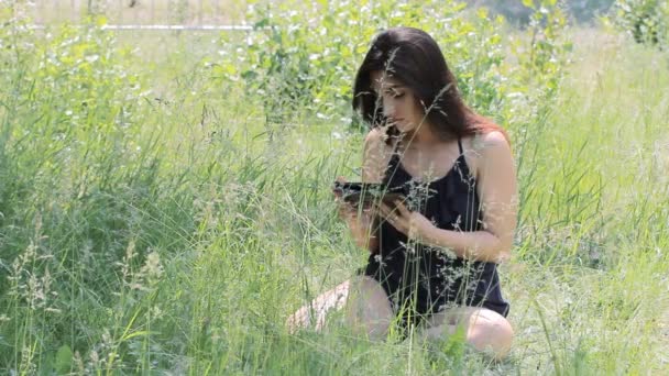 Young Girl Tourist using Map app on Smartphone in the Forest. — Stock Video