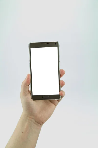 Smartphone met lege display in hand geïsoleerd — Stockfoto