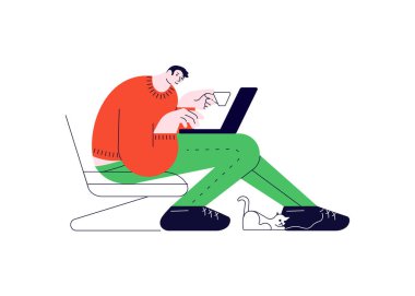 Dizüstü bilgisayarı olan adam koltukta oturuyor.