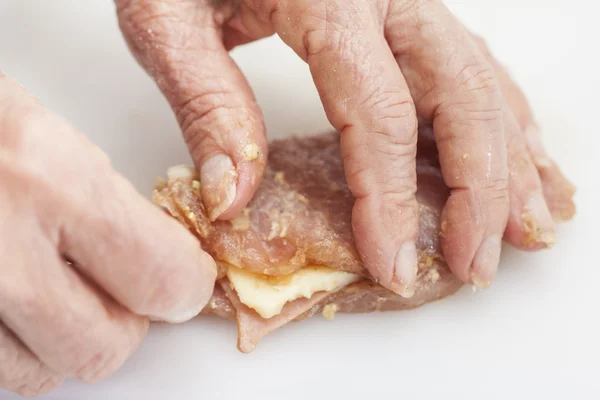 Filling the pork loin with cheese and ham — Stock Photo, Image