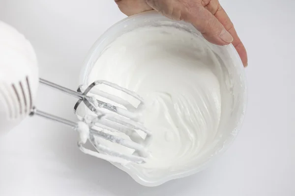 Egg whites snow in a white bowl — Stock Photo, Image