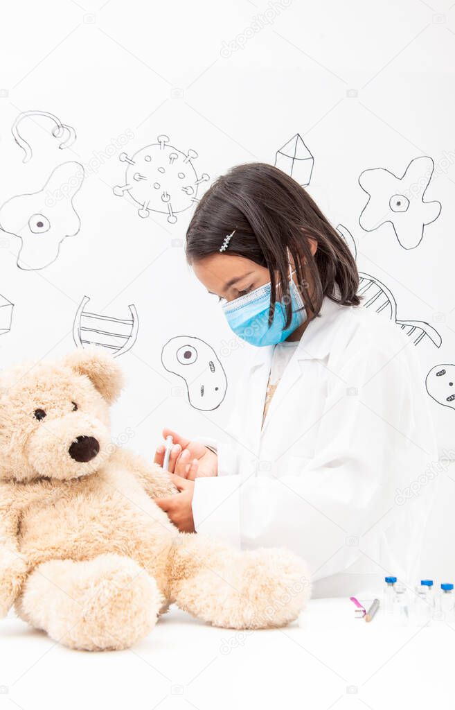 Young girl vaccinating. Young girl playing a life sciences professional role. Could be biologist, doctor, researcher, veterinary. Dreaming about the future.