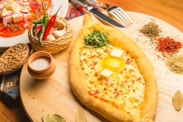 Hot Georgian bread with butter and egg yolk — Stock Photo, Image