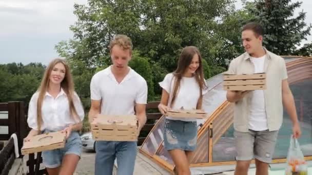 Friends Carrying Pizza Hands Group Young Caucasians Take Pizza Boxes — Wideo stockowe