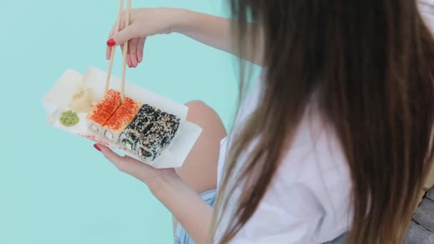 Woman Takes One Sushi Roll Sushi Takeaway Box Female Eats — Stockvideo