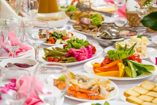 Banquet Table in restaurant served with different meals.