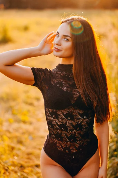 Brunette Lace Black Bodysuit Posing Field Sunset Stock Photo