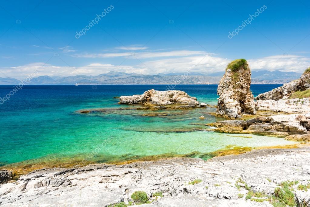 rocky beach in Kassiopi in Corfu island, Greece