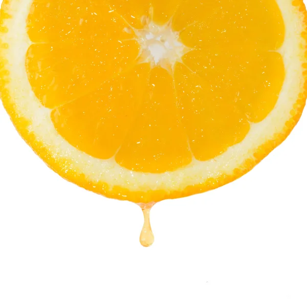 Drop of juice falling from orange — Stock Photo, Image