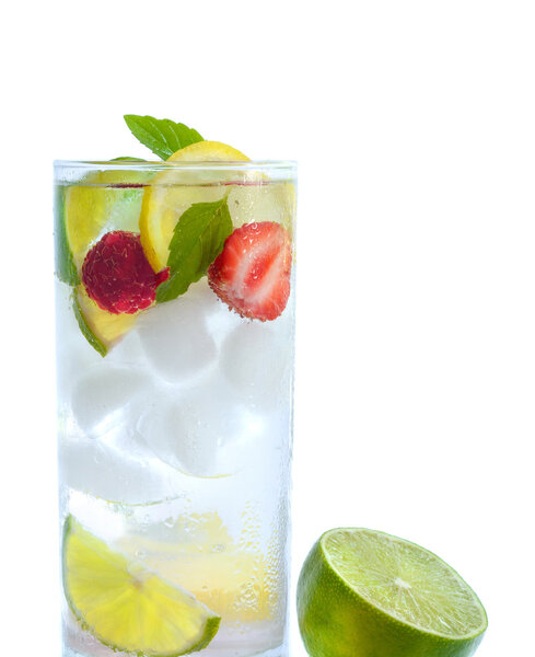 fresh cocktail drink with ice and fruits isolated on white