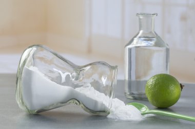 Natural cleaning tools lemon and sodium bicarbonate clipart