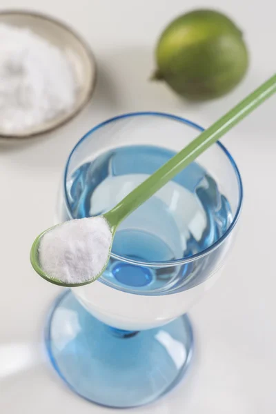 glass of water, lemon, soda bicarbonate natureal solution