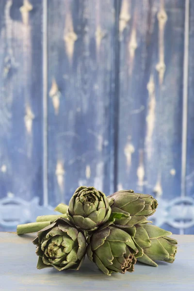 Fresh artichokes with stem and leaf — Stock Photo, Image