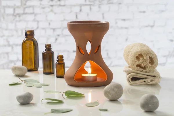 Aromatherapy votive candles burning in essential oil diffuser for wellness treatment in spa — Stock Photo, Image