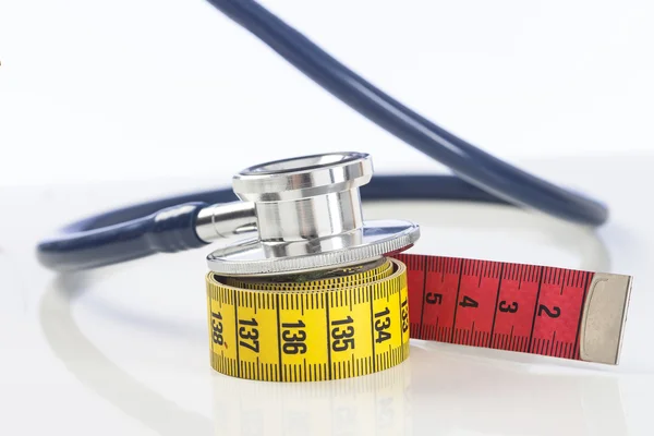 Tape measure with stethoscope — Stock Photo, Image