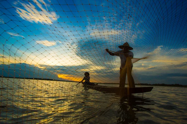 Fisherman, sunset, sillouette — Stock Photo, Image