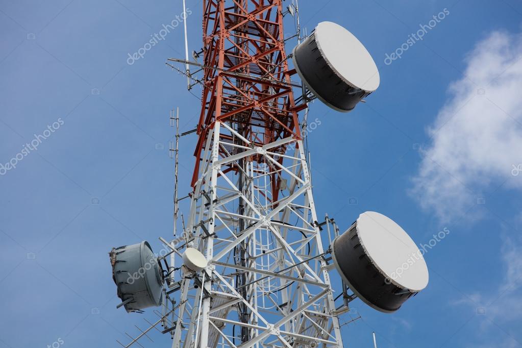 Close up antenna repeater tower on blue sky. — Stock Photo © 104573804