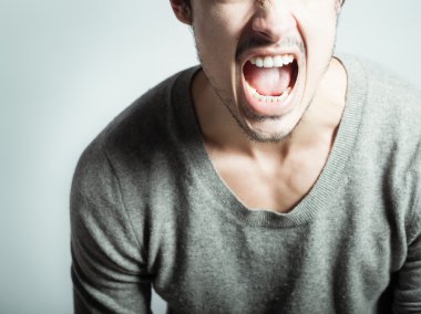 Angry man screaming clipart