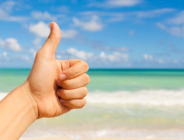 Thumbs up at the beach clipart