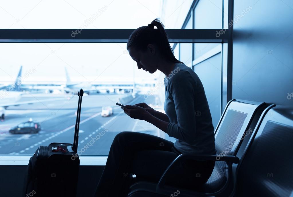 Female traveler using her cellphone