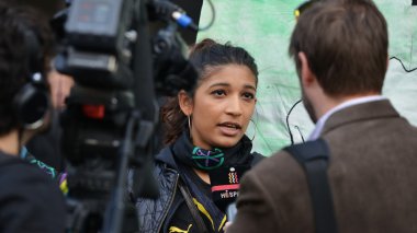 A protester gives an interview to news media 