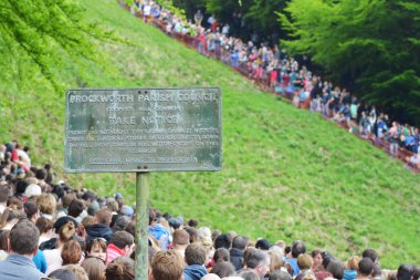The traditional cheese rolling races in Brockworth, UK. clipart