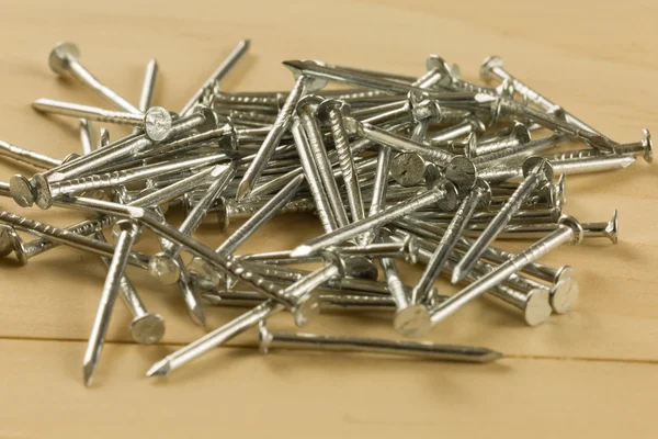 Nails on wood table — Stock Photo, Image