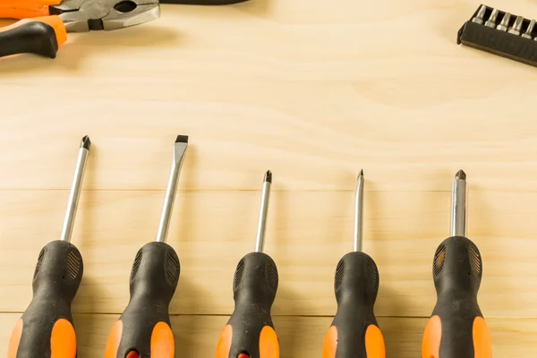 Screwdriver set on wood table — Stock Photo, Image