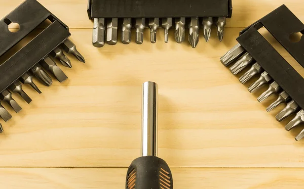 Screwdriver set on wood table — Stock Photo, Image