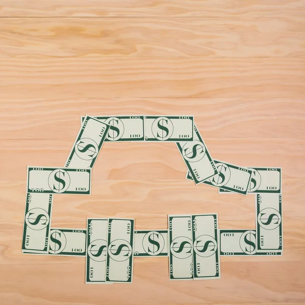 Χαρτονομίσματα των δολαρίων σε ξύλινο τραπέζι — Φωτογραφία Αρχείου