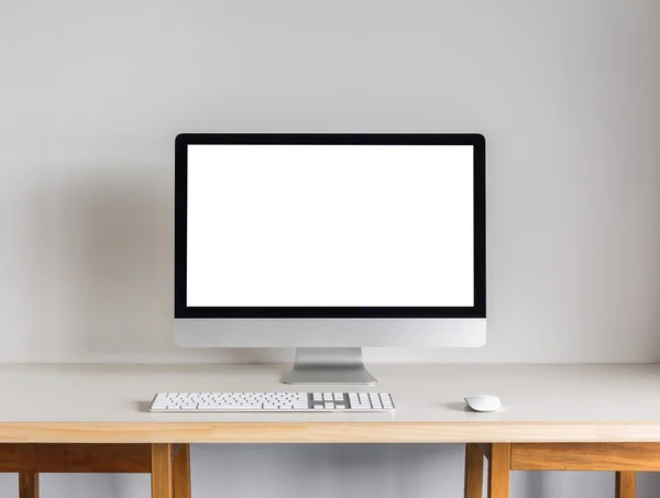 desktop computer on wooden table