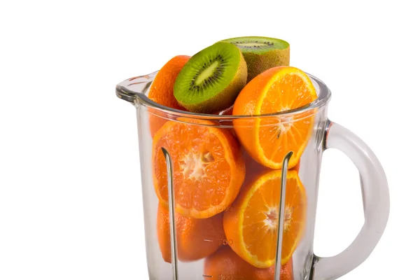 Oranges and kiwifruits in a blender — Stock Photo, Image