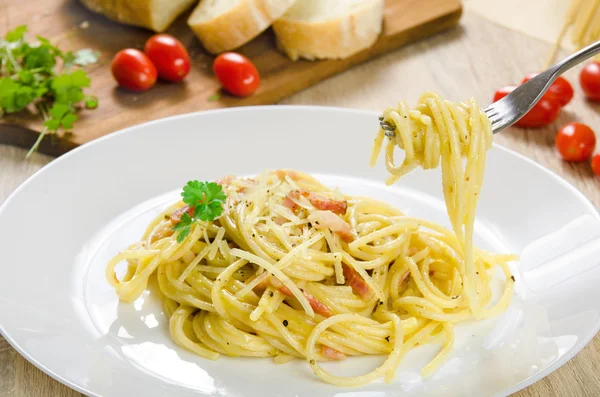 Pasta Carbonara with bacon on a white plate — Stock Photo, Image