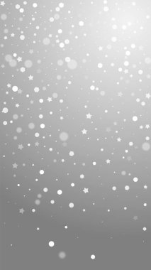 Sihirli yıldızlar rastgele Noel arkaplanı. İnce uçan kar taneleri ve gri arkaplanda yıldızlar. Temyize giden Gümüş Kar Tanesi şablonu. Çarpıcı dikey illüstrasyon.
