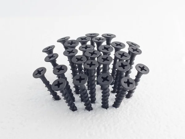 Beam black screws on white — Stock Photo, Image