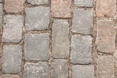 Taş kaldırım dokusu. Granit cobblestoned kaldırım arka plan. Arka plan eski kaldırım taşı kaldırım yakın çekim. Mükemmel döşenmiş ve tüm yan için yakın