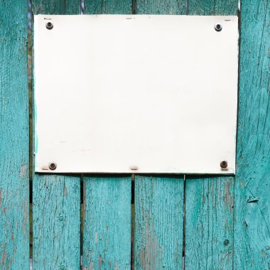 empty white board over wood wall background. Place for text. clipart