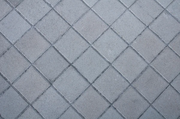Pavimentazione grigia di lastre laterali rettangoli. Texture inclinabile senza cuciture . — Foto Stock