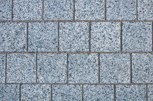 Granito adoquín piedra ladrillo pavimento fondo — Foto de Stock