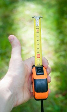 Ölçü elinde bant. Ev geliştirme ve D ben Y. kullanma mezura doğruluğunu sağlamak için