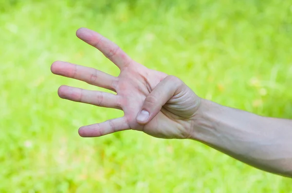 La mano muestra cuatro dedos — Foto de Stock